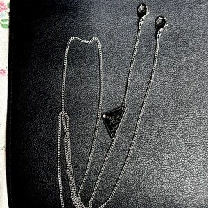 Prada logo glasses strap.